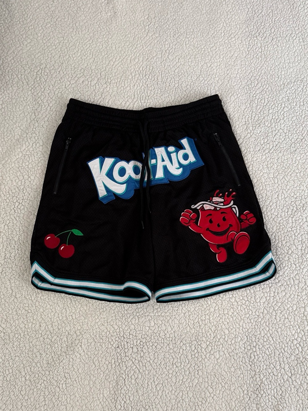Kool-Aid Men’s Athletic Shorts Featuring The Kool-Aid Man Graphic, Size Medium.